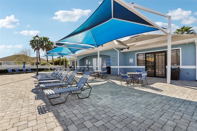 view of patio / terrace with outdoor dining space and fence