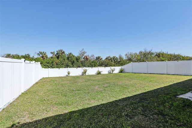 view of yard featuring a fenced backyard