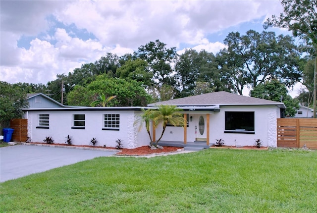 ranch-style home with a front yard