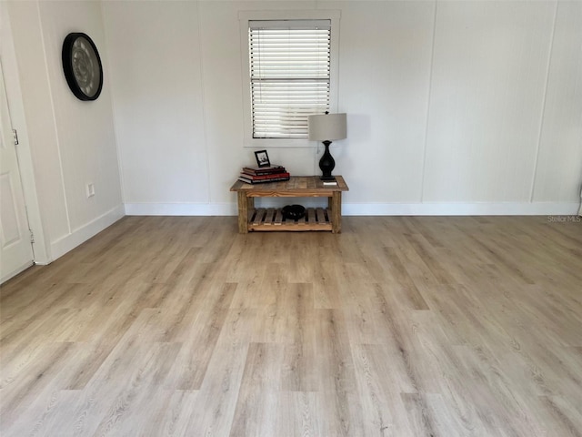 unfurnished room with light wood-type flooring