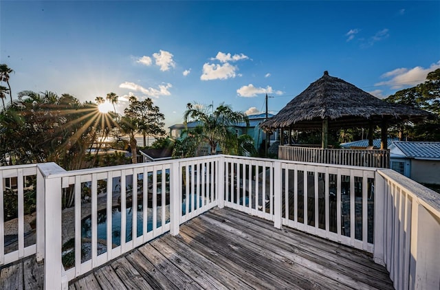 wooden terrace featuring a gazebo