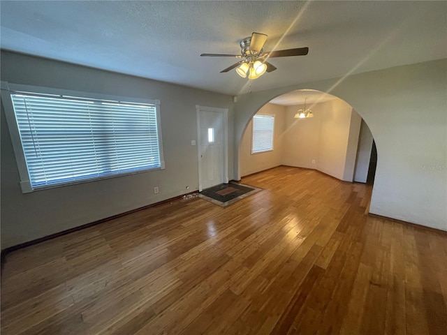 interior space with hardwood / wood-style floors, a textured ceiling, and ceiling fan