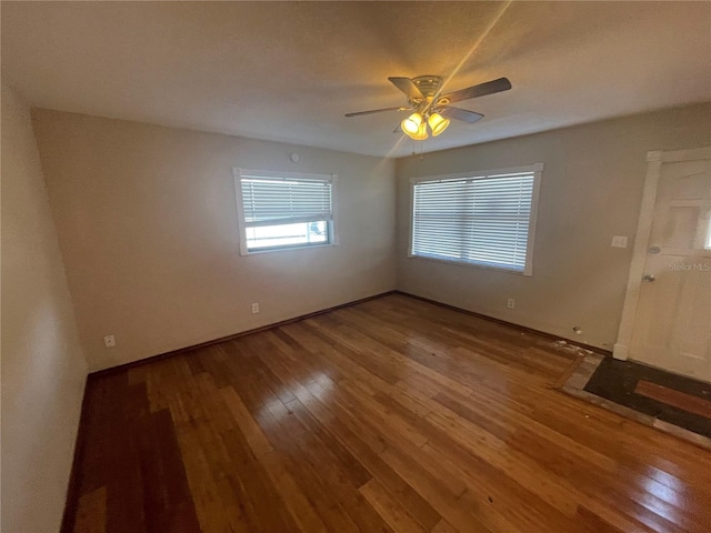 empty room featuring ceiling fan and wood-type flooring