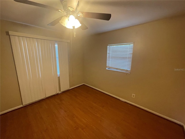 unfurnished room featuring hardwood / wood-style flooring and ceiling fan