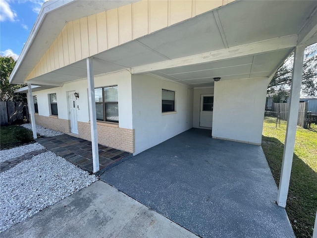 view of home's exterior with a carport