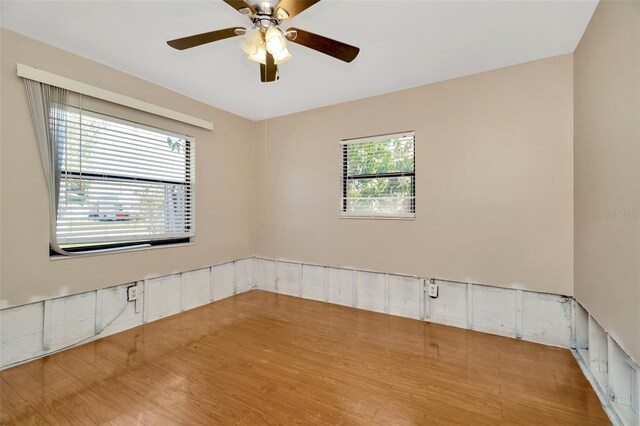 540 Florida Cir S, Apollo Beach, FL 33572 - spare room with a ceiling fan and wood finished floors