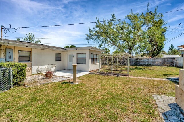 540 Florida Cir S, Apollo Beach, FL 33572 - view of yard featuring a fenced backyard, electric panel, and a patio area