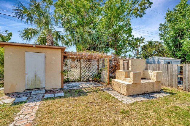 540 Florida Cir S, Apollo Beach, FL 33572 - view of yard with an outbuilding, fence, and a storage unit