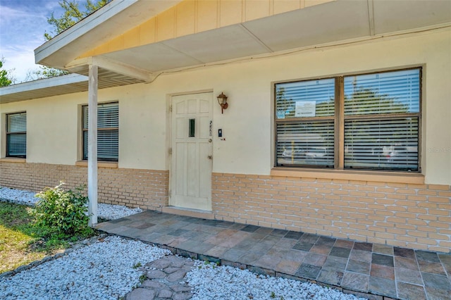 540 Florida Cir S, Apollo Beach, FL 33572 - property entrance with stucco siding and brick siding