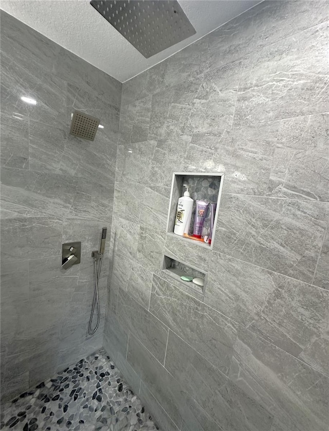 bathroom with tiled shower