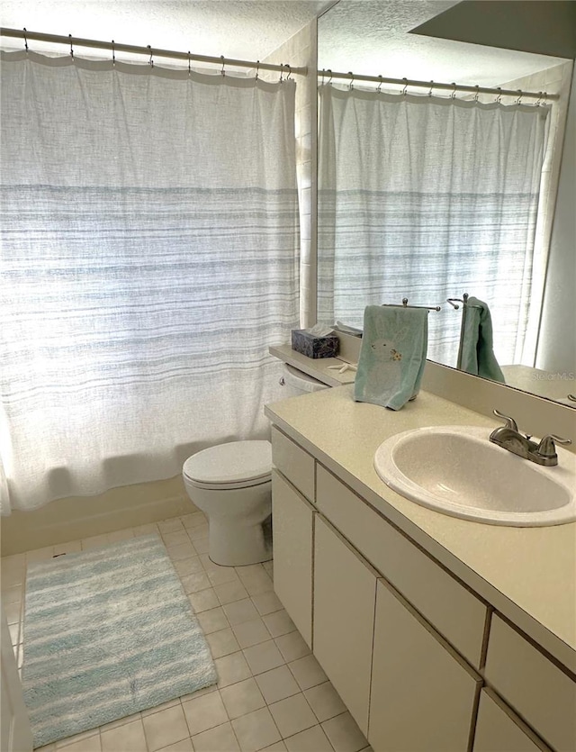 full bathroom featuring tile patterned floors, toilet, shower / tub combo, and vanity