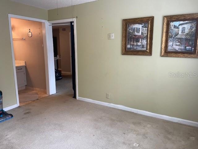 unfurnished room with carpet flooring