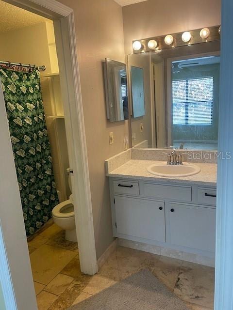 bathroom with vanity, a textured ceiling, toilet, and a shower with shower curtain