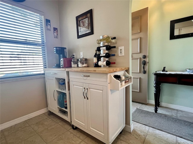 bar with white cabinetry