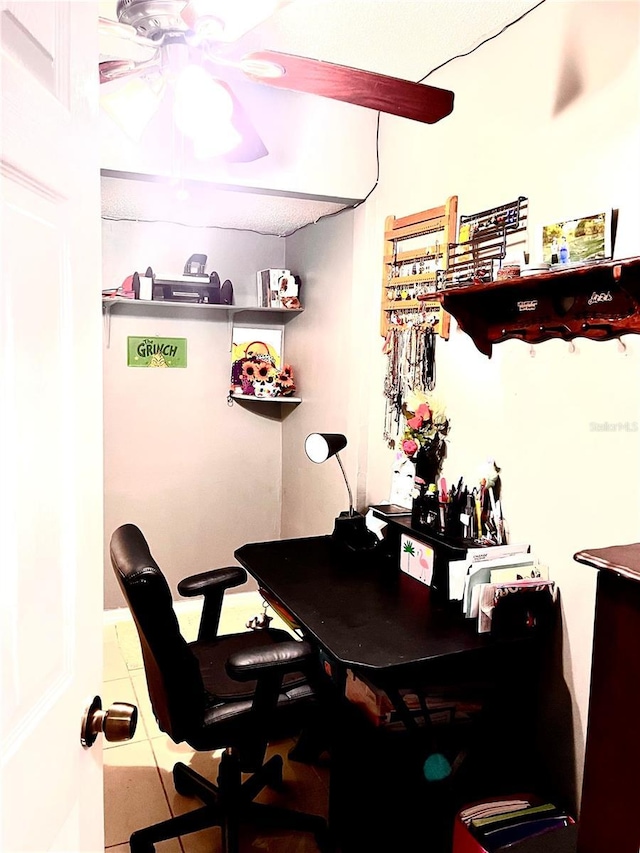 tiled home office with ceiling fan