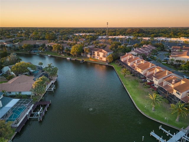 aerial view at dusk with a water view