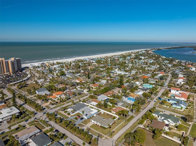 bird's eye view with a water view and a beach view