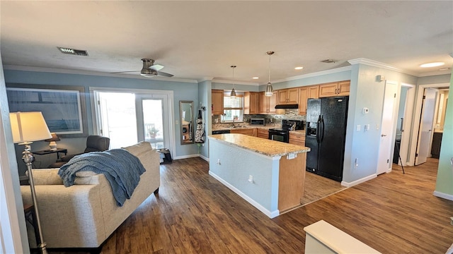 kitchen featuring dark hardwood / wood-style flooring, a center island, hanging light fixtures, and black appliances