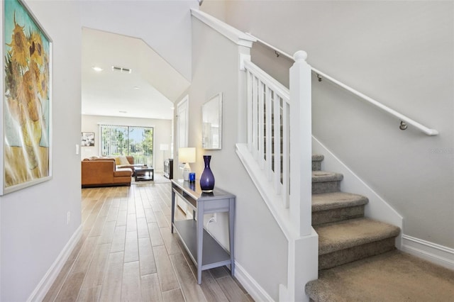 staircase featuring hardwood / wood-style floors