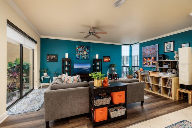 living room featuring ornamental molding, hardwood / wood-style floors, and ceiling fan