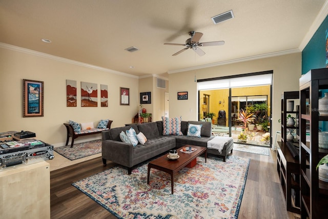 living room featuring crown molding, ceiling fan, and dark hardwood / wood-style flooring