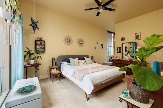 bedroom with light carpet and ceiling fan