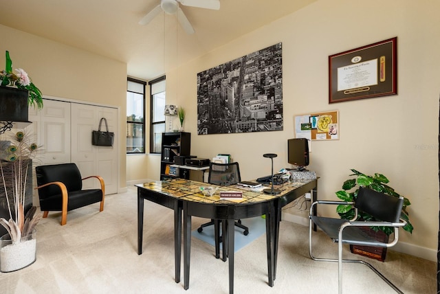 carpeted office with ceiling fan