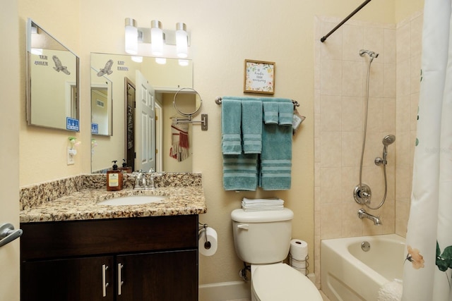 full bathroom with vanity, toilet, and shower / bath combo with shower curtain