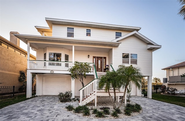 view of front of home with a garage and a porch