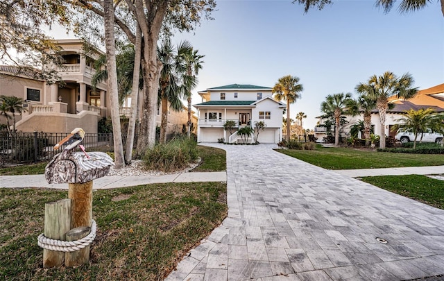 view of front of house featuring a garage and a front yard