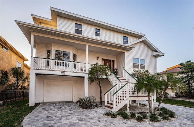 view of front of home with a garage and a porch