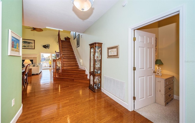 corridor with hardwood / wood-style floors