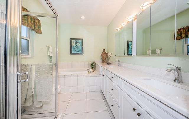 bathroom featuring tile patterned flooring, plus walk in shower, and vanity