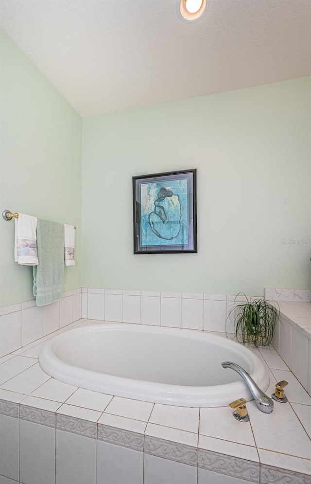 bathroom with tiled bath