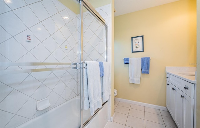 full bathroom featuring tile patterned flooring, vanity, shower / bath combination with glass door, and toilet