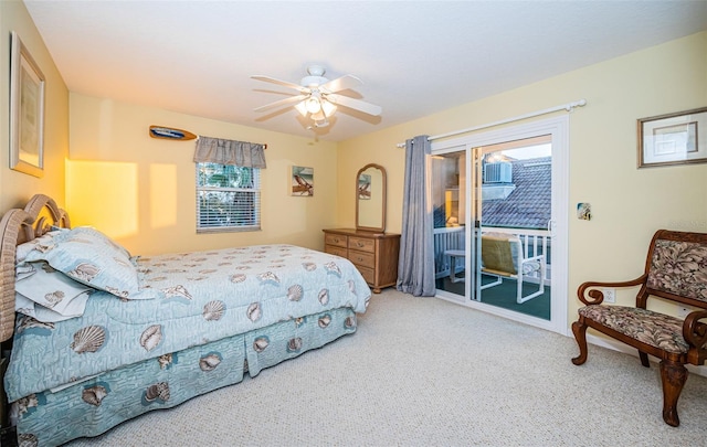 bedroom featuring access to outside, ceiling fan, and carpet