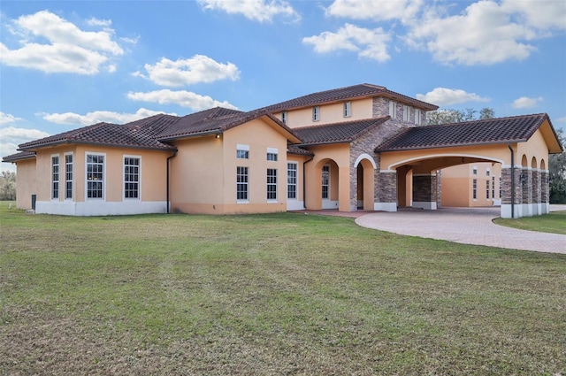 rear view of property with a yard