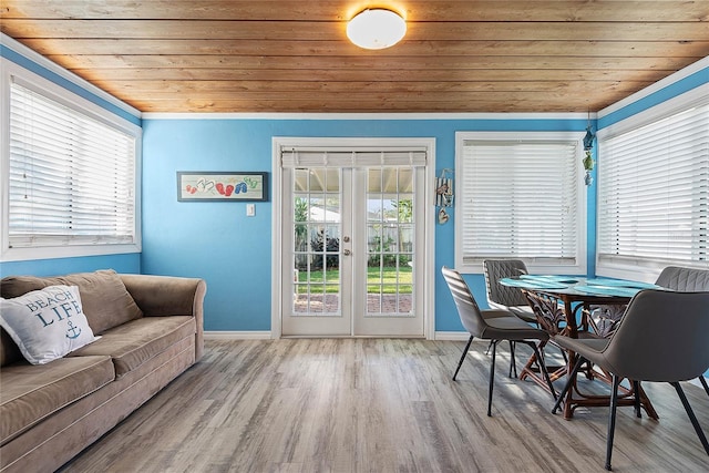 interior space featuring wooden ceiling, french doors, and light wood-type flooring