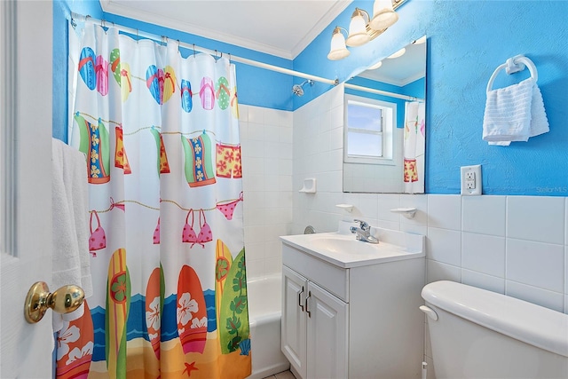 full bathroom with toilet, tile walls, ornamental molding, shower / bathtub combination with curtain, and vanity