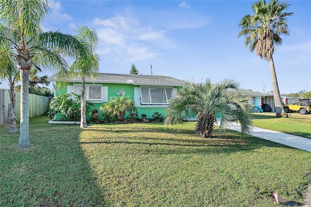 single story home with a front lawn