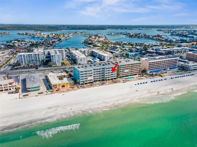 birds eye view of property with a beach view and a water view