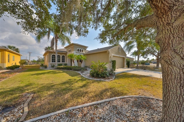 view of front of home with a garage and a front lawn