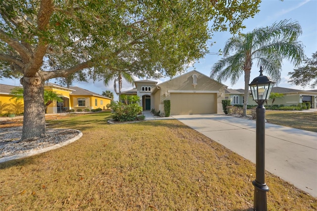 view of front of house featuring a garage and a front lawn