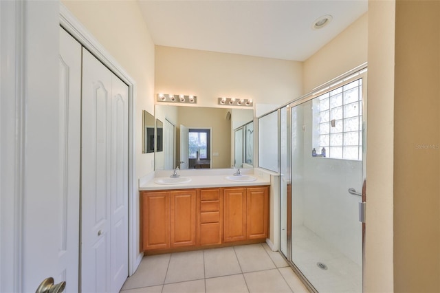 bathroom with vanity, tile patterned floors, and walk in shower