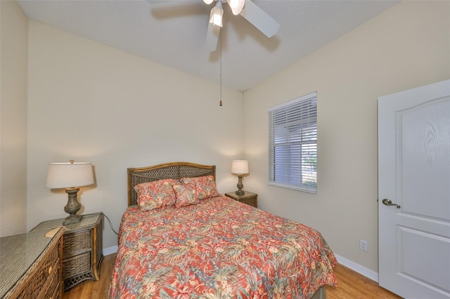 bedroom with ceiling fan and light wood-type flooring