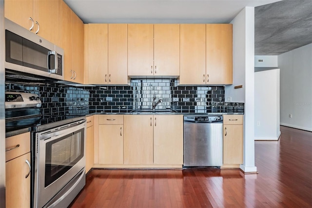 kitchen featuring sink, stainless steel appliances, dark hardwood / wood-style floors, and light brown cabinets