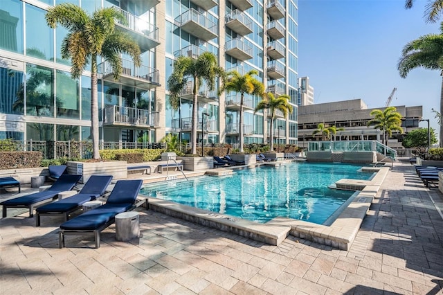 view of swimming pool with a patio