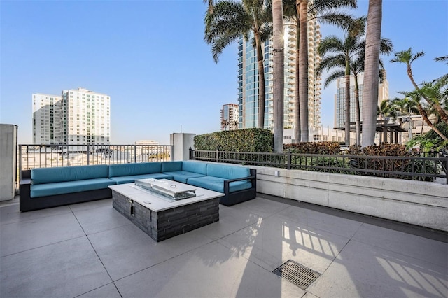 view of patio / terrace with an outdoor living space with a fire pit