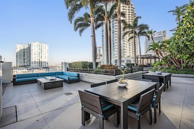 view of patio / terrace with an outdoor living space with a fire pit