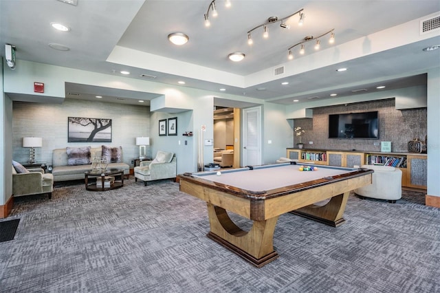 recreation room with a tray ceiling, billiards, rail lighting, and carpet